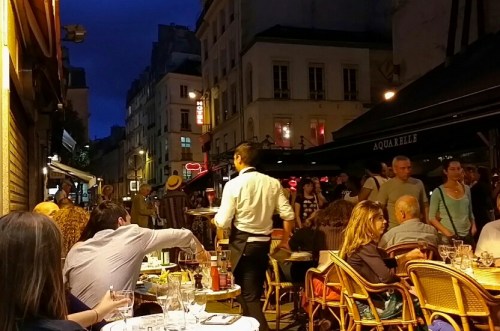 One of my favorite photos in Paris, sitting at a cafe watching the world go by. 